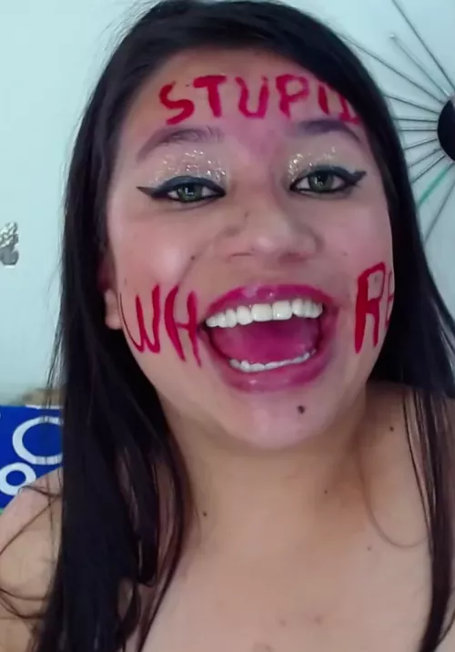 look how happy she is to be labelled a stupid whore <3