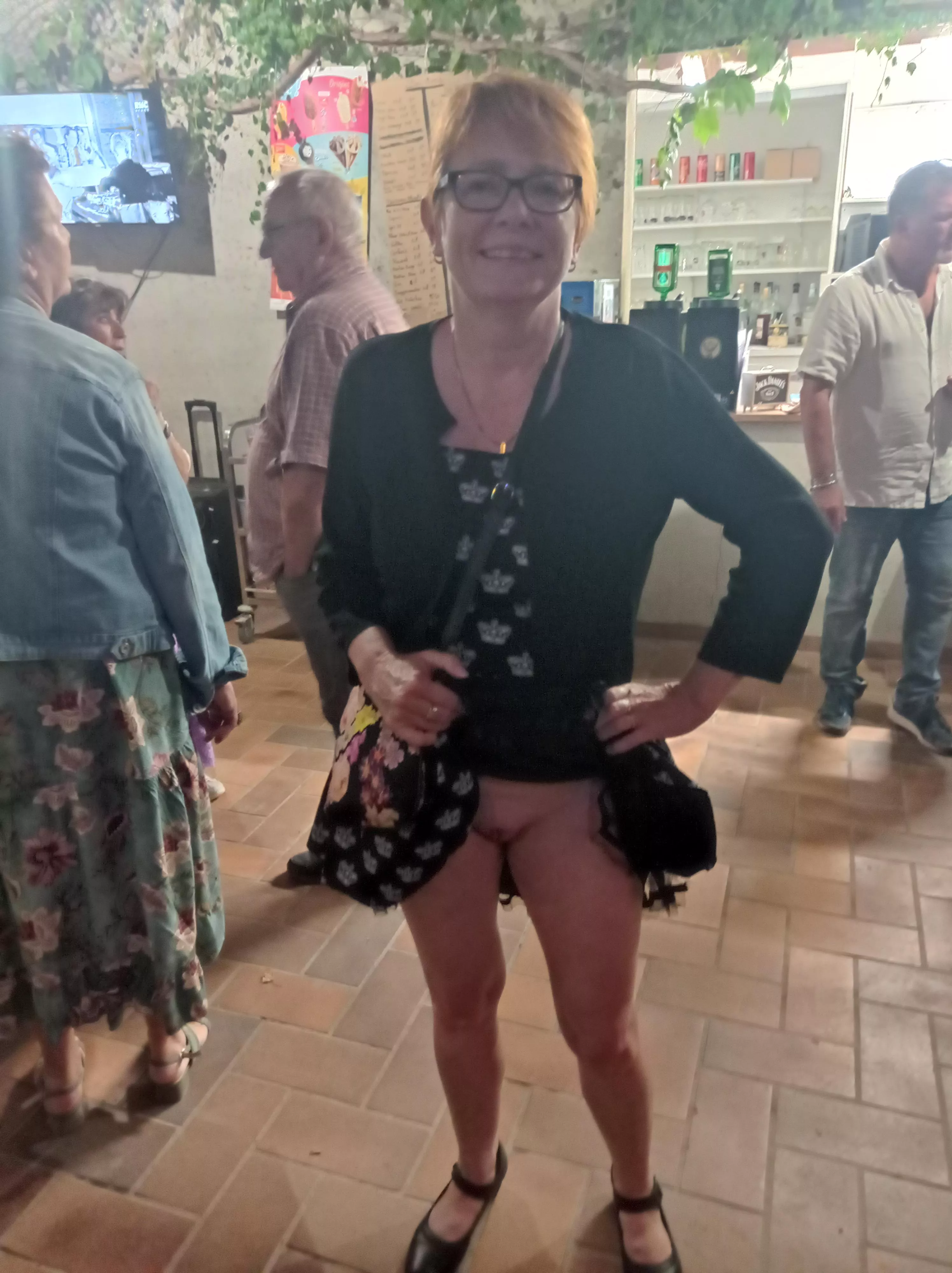 the redhead glasses BDSM MILF with shaved pussy and big tits flashing