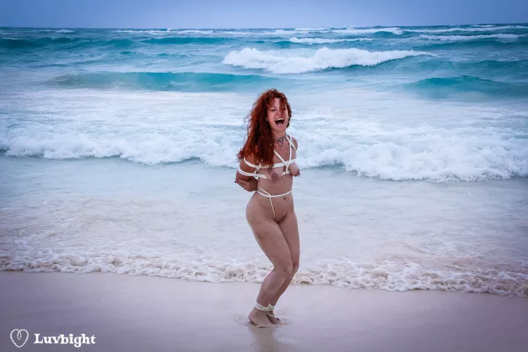 Dee Luvbight roped nude on a public beach. Yes, there were lots of people around, they just didn't want to be in the photo.