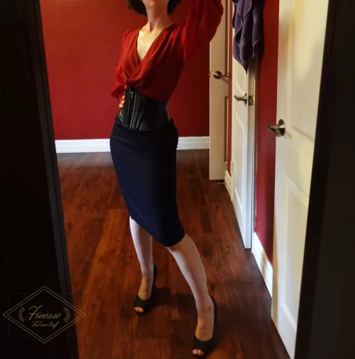 A leather corset makes an office casual look to a whole new level!