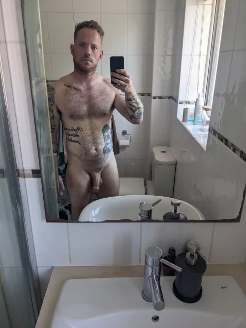 me looking grumpy, taking a photo of myself naked [m]31