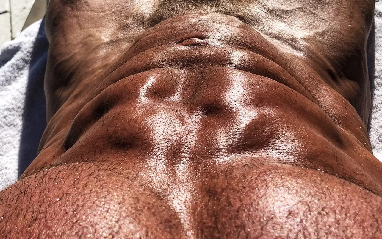 Daddy is oiled up ready for some vitamin D....