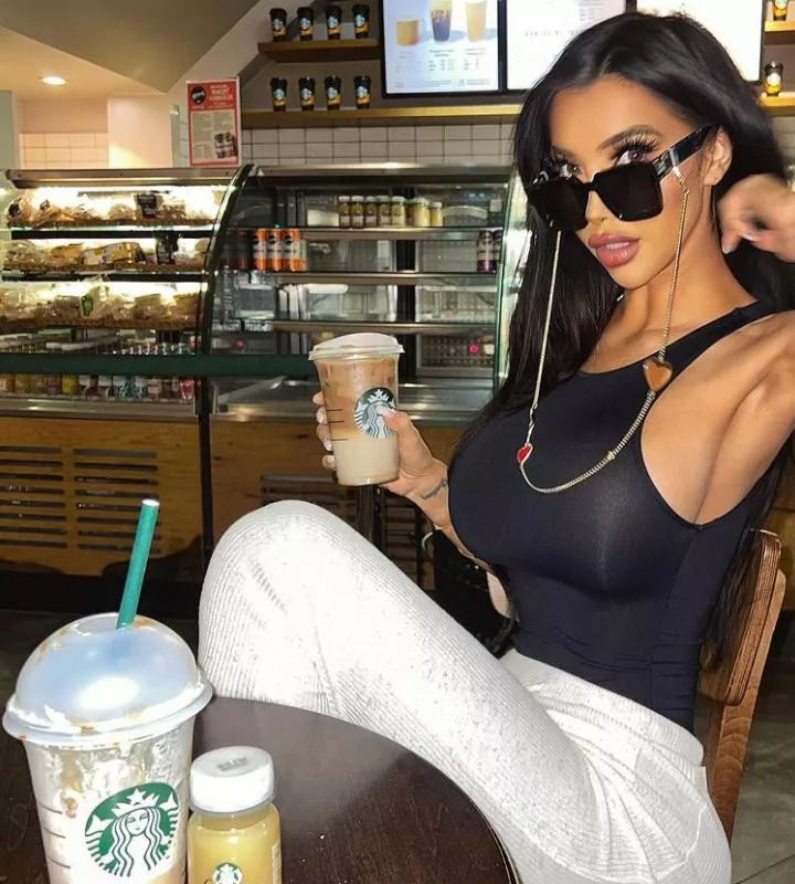 drinking Starbucks coffee