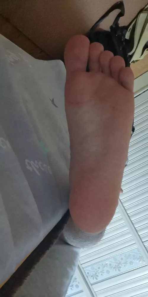 Pushing it against your stomach