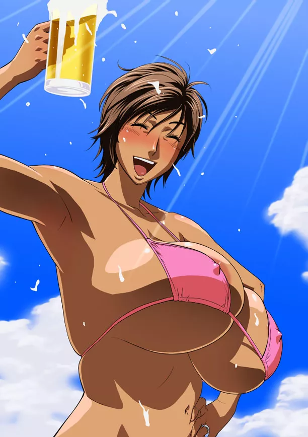 In the beach, with a glass of beer.
