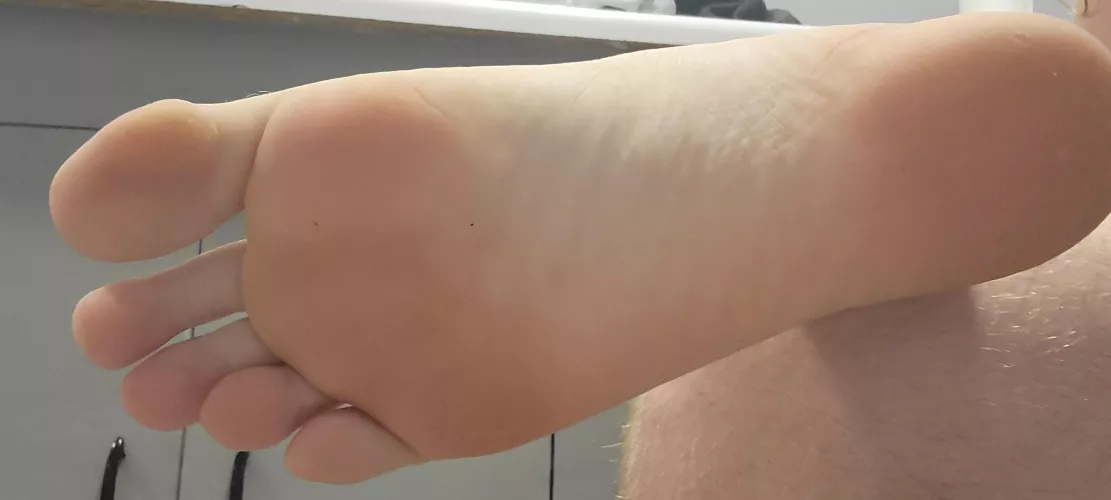 Size 15 feet, fresh from the shower and waiting for you to lotion them.