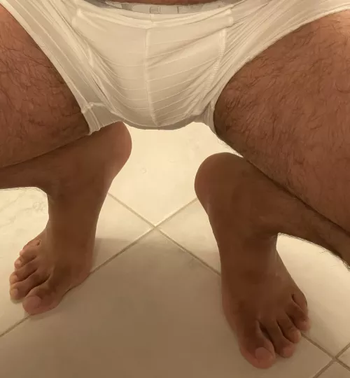 Crouching feet, hidden bulge. 😈