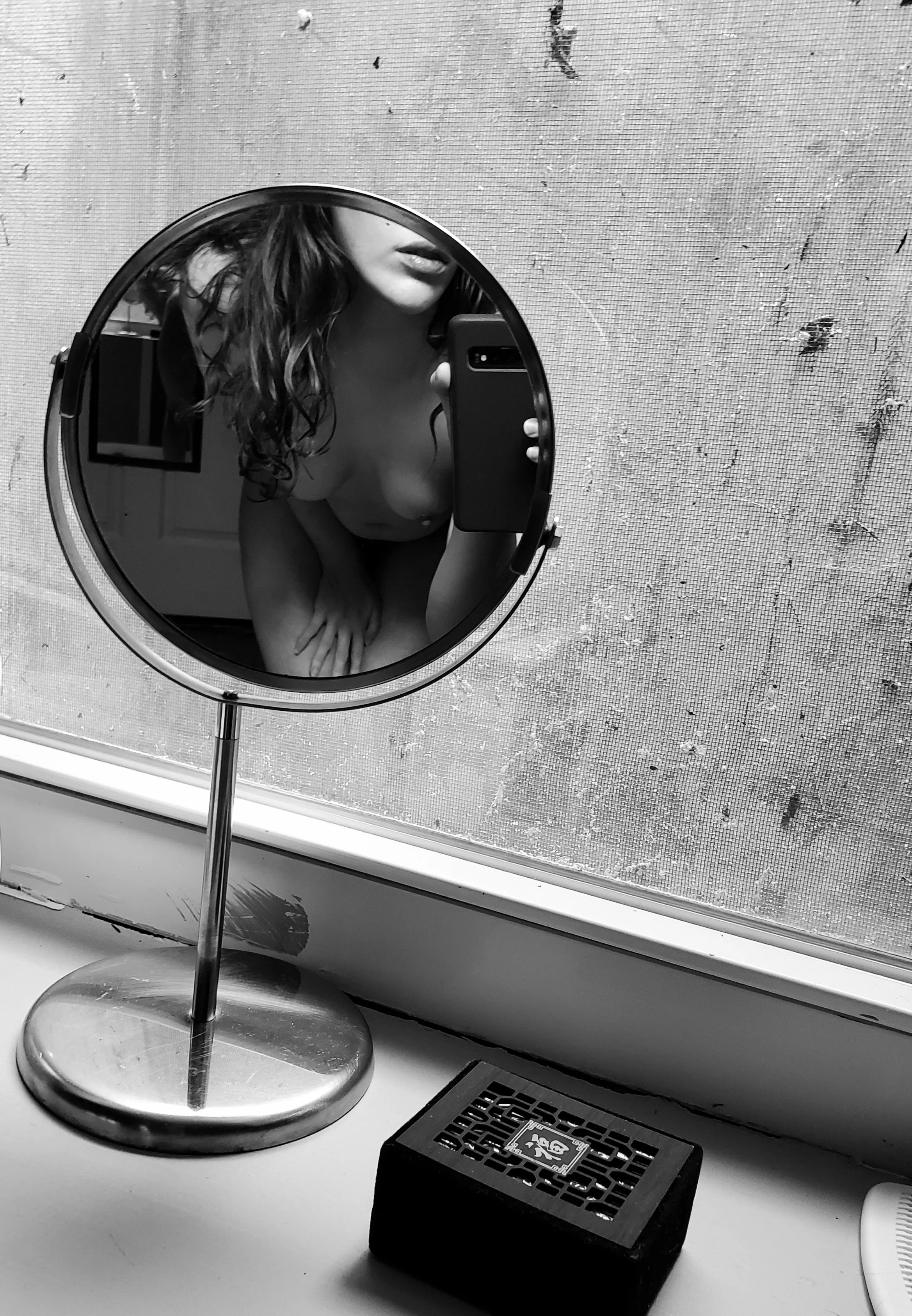 Photograph within a mirror within a Photograph.