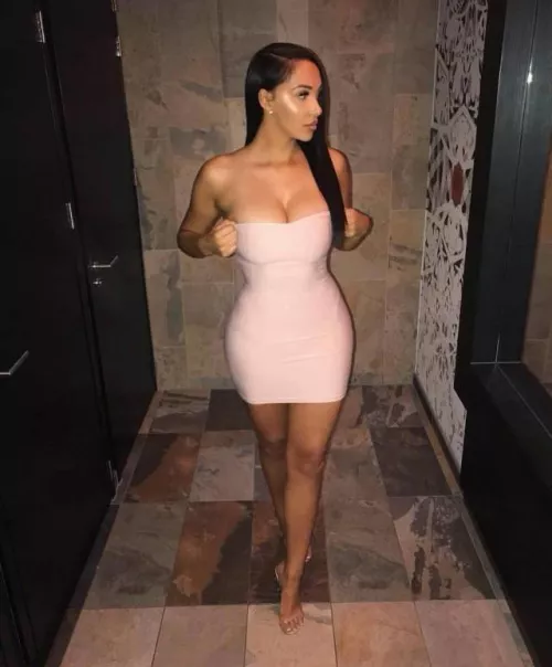 Looks like a struggle to keep her dress up