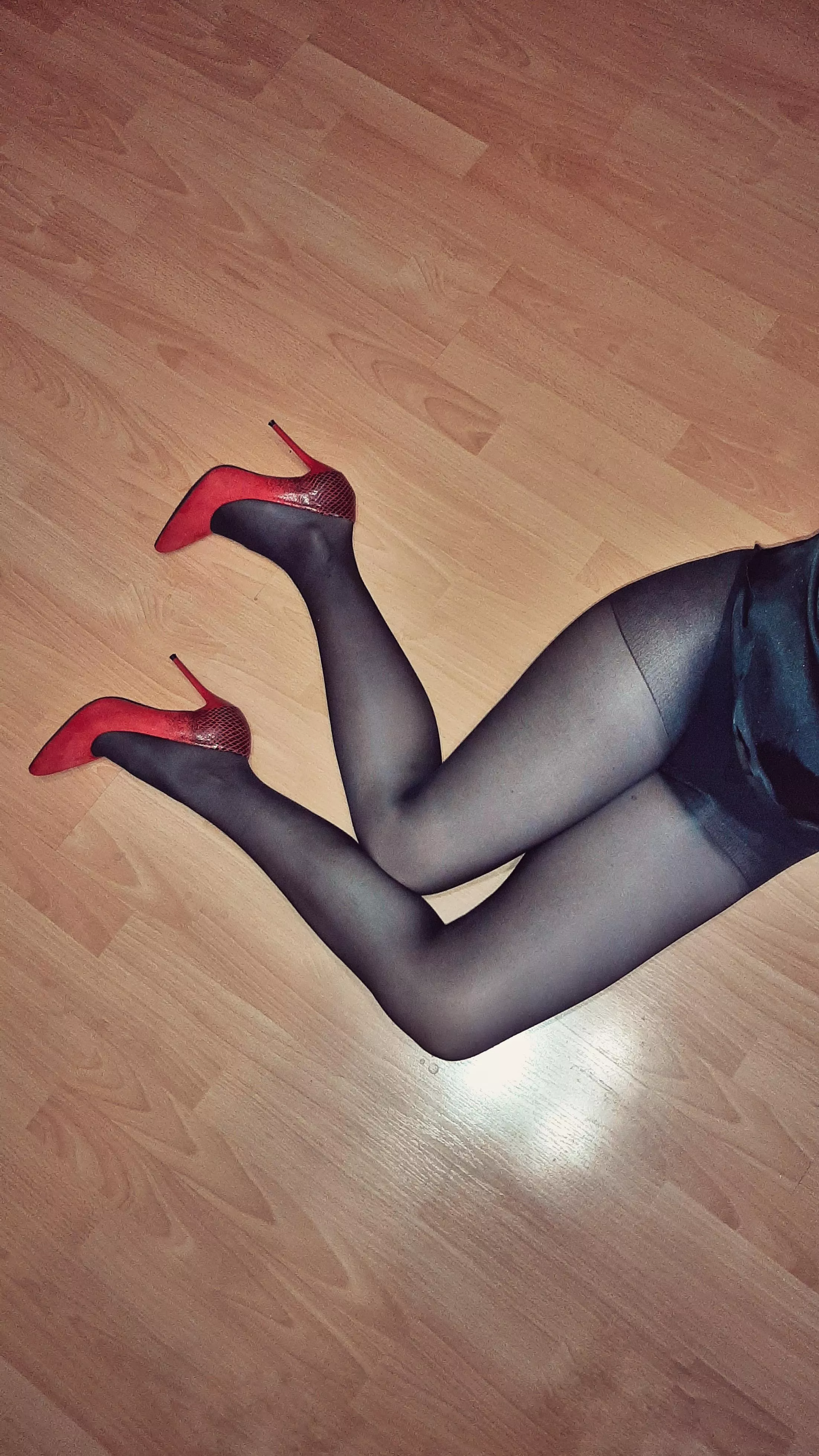 Black pantyhose (or stockings) and red heels it is classic combination.