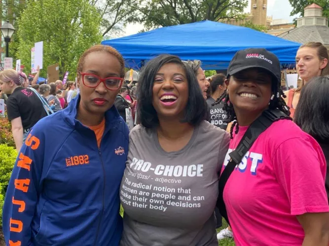 Girl in the red glasses is not having a good time.