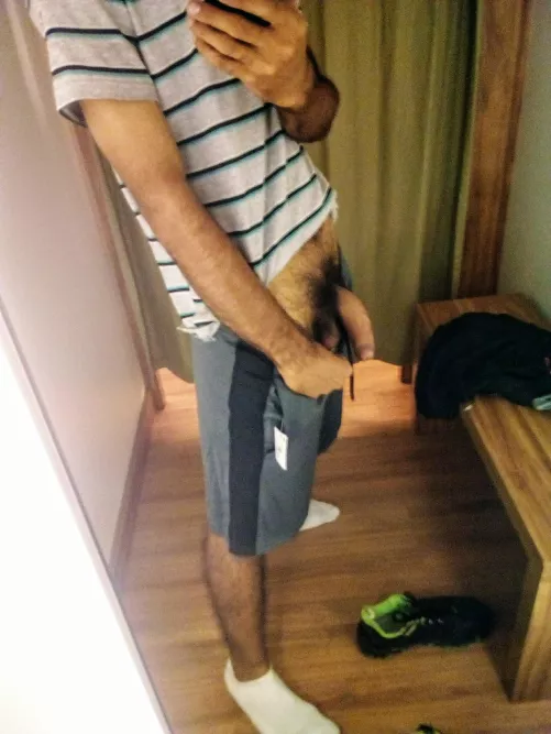 In the mirror of a store. I love grey sport shorts.