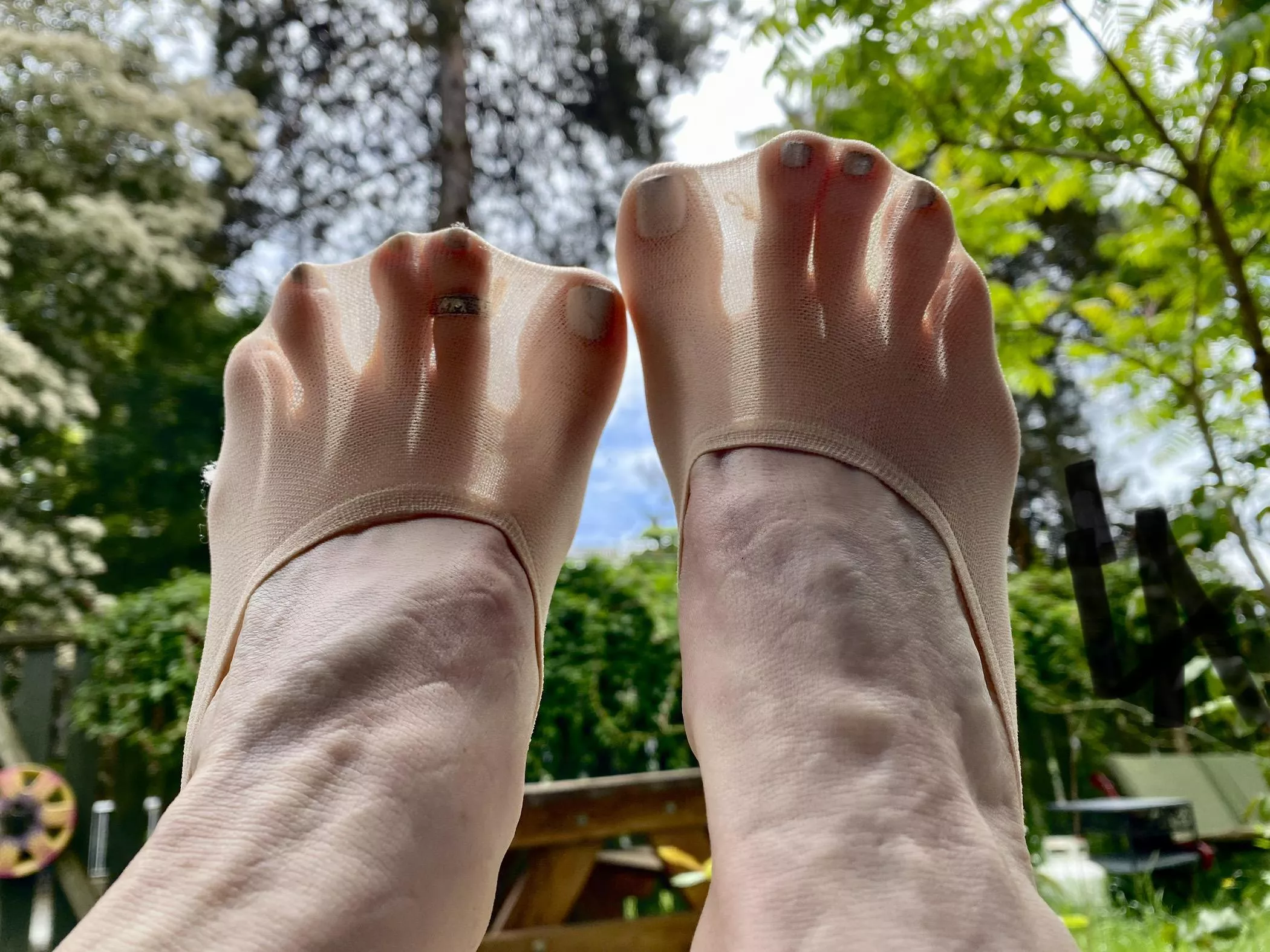 look how my tiny toes look through nude nylon sockets