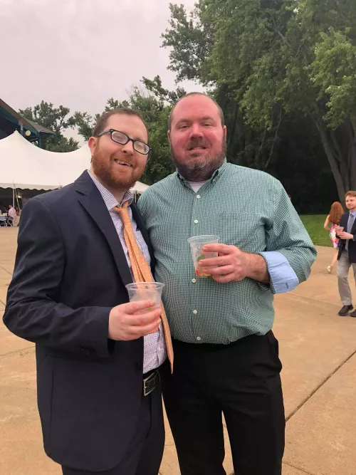 My partner and I at a wedding! I’m the cub on the left :)