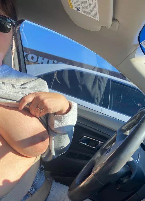 My wife flashing. She loves showing off. The guy in the car next to us honked and waved.