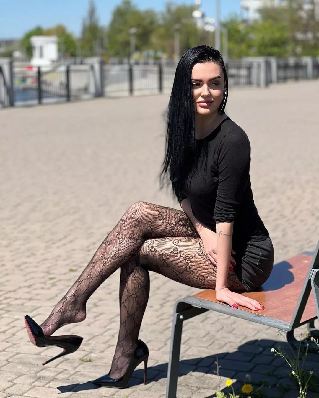 Patterned tights and a dangling heel