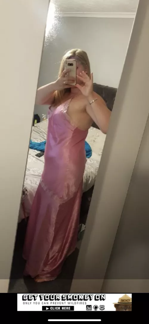 Woman in satin pink nightdress