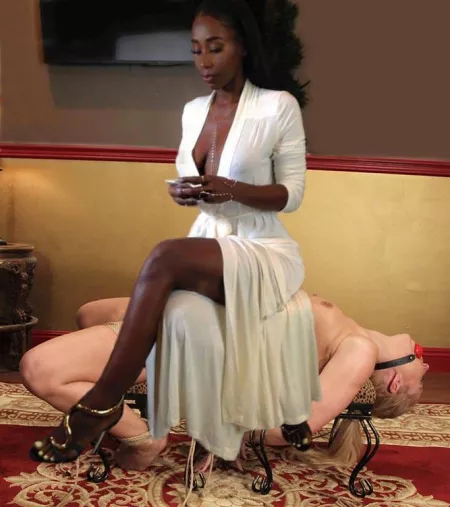 A Queen astride her throne.