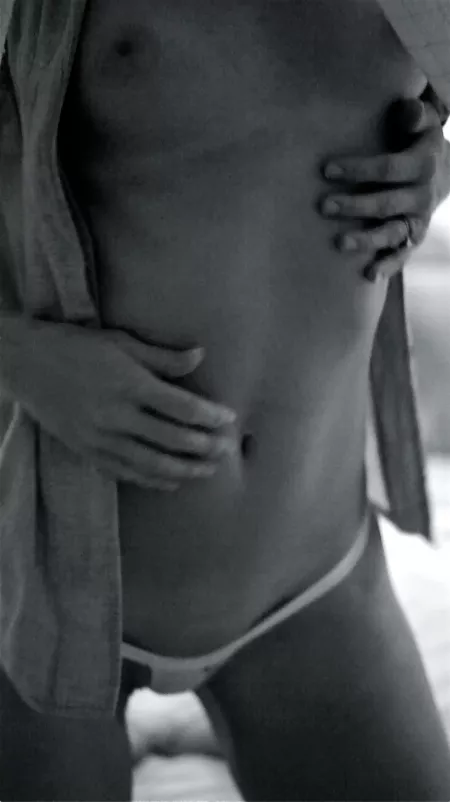 Caught a series of shots with real film and an old SLR camera - just up from the beach, my wife dusting sand and salt off her body. WW micro workwear 427's I think here...