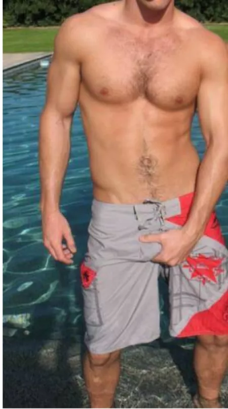 Grabbing through his board shorts