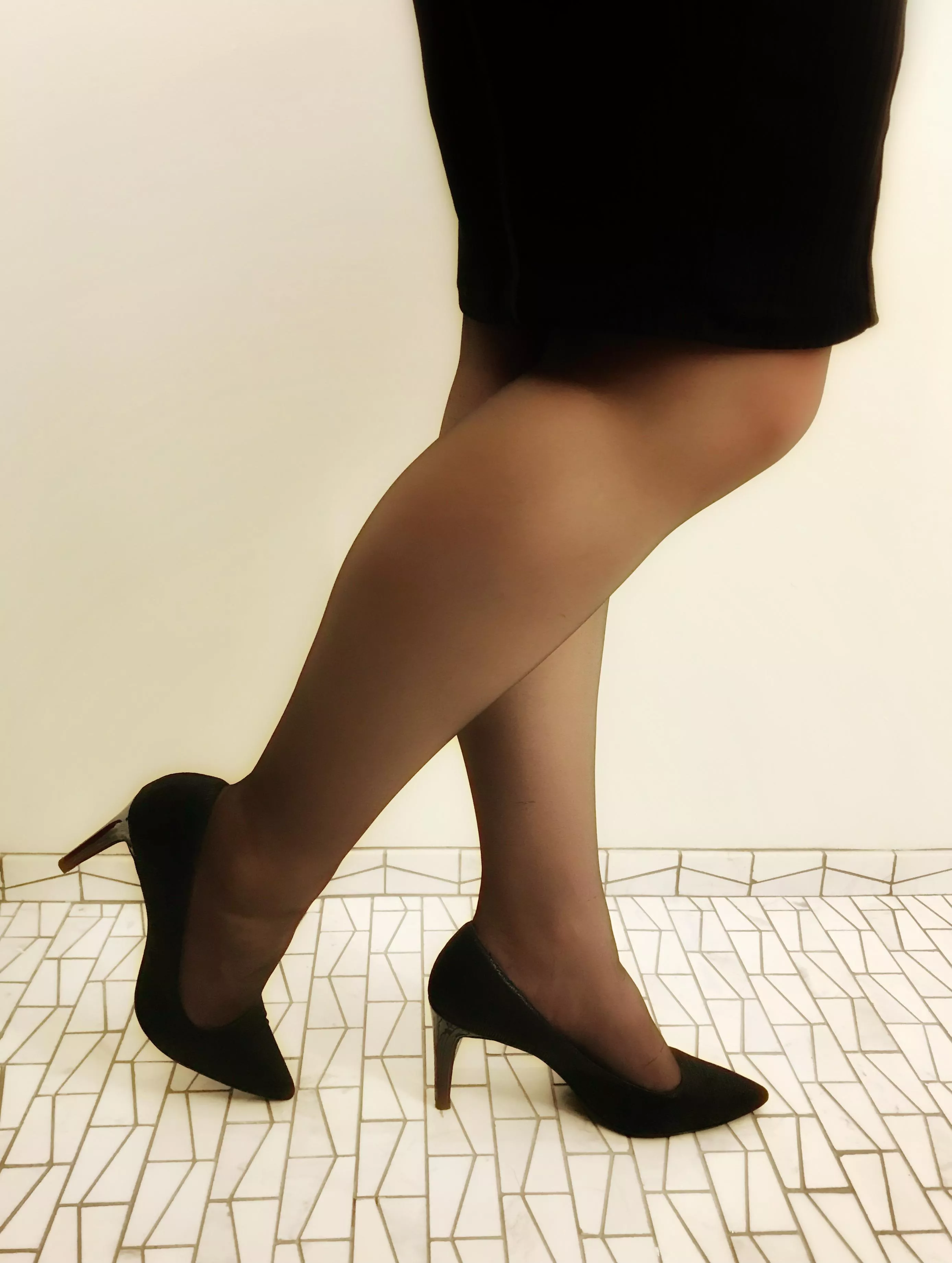 Hard enough to stay focused at work with the clack of heels; even more so when she has nylons on…