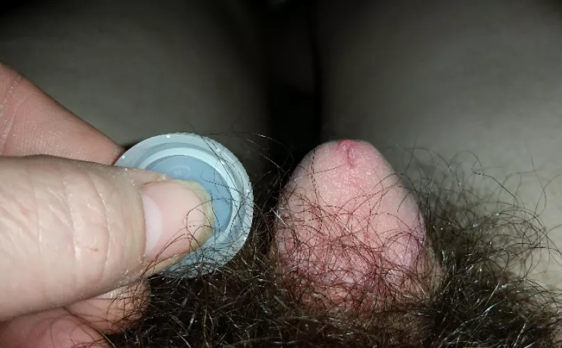 Here's a pic of my little guy close to halfway hard compared to a water bottle cap...