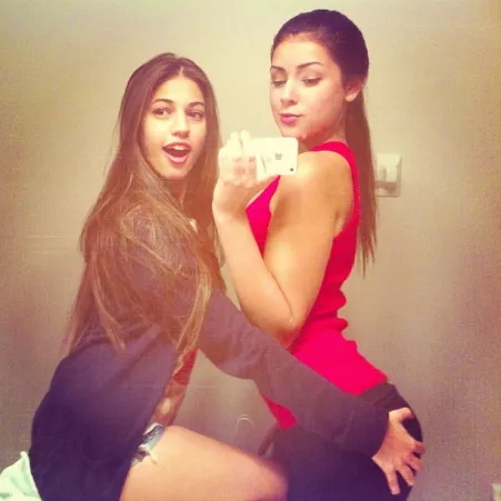 one hand on her friend's ass