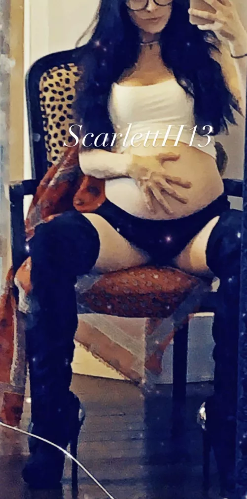 Thigh high boots on a pregnant Latina